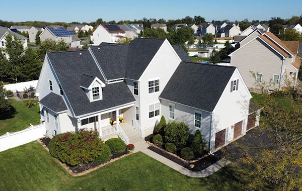 Mid-class home with a new black shingle roof