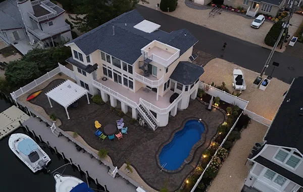 Large, high-end home with a new black shingle roof